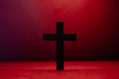 black cross with red background